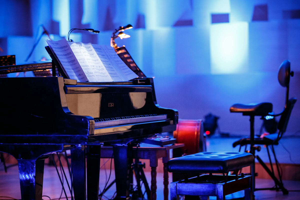 Black grand piano in atmospheric lighting